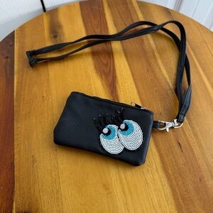 Claire’s black faux leather eyes lashes crossbody